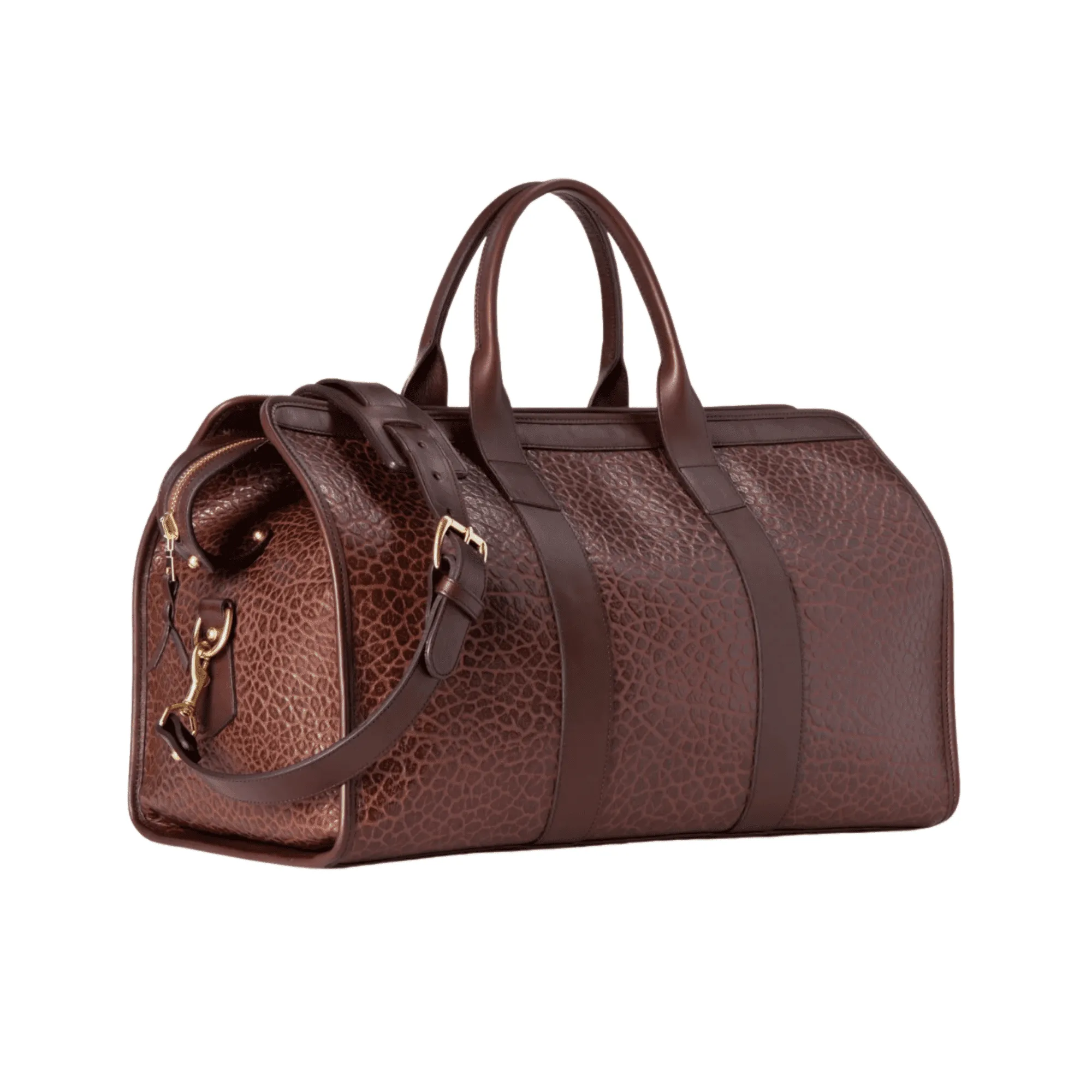 Side angle of the leather duffel showing sturdy handles, detachable strap, and balanced proportions.