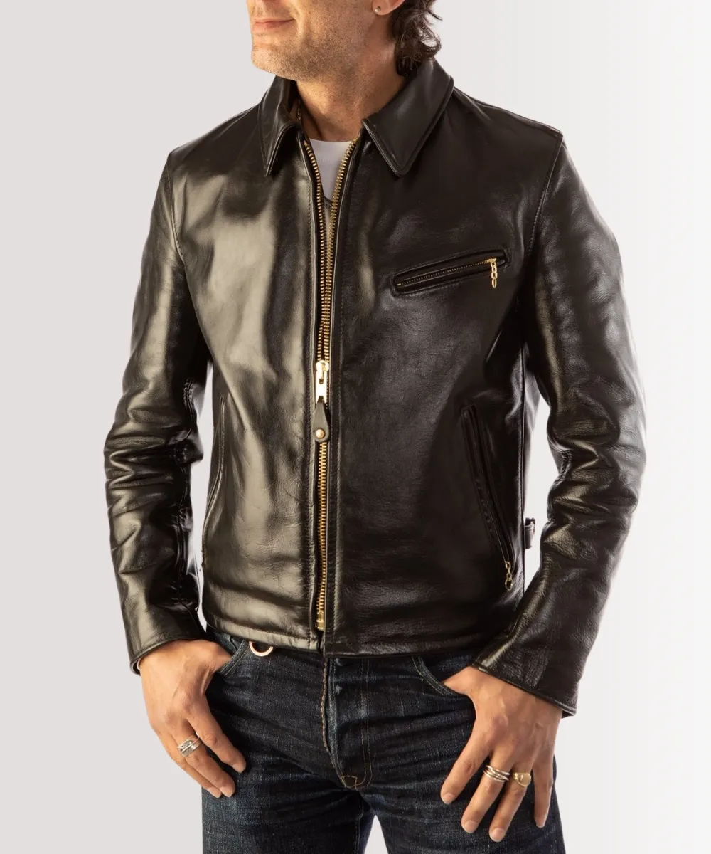 Close-up detail of a vintage 1980s leather jacket showing intricate stitching and texture