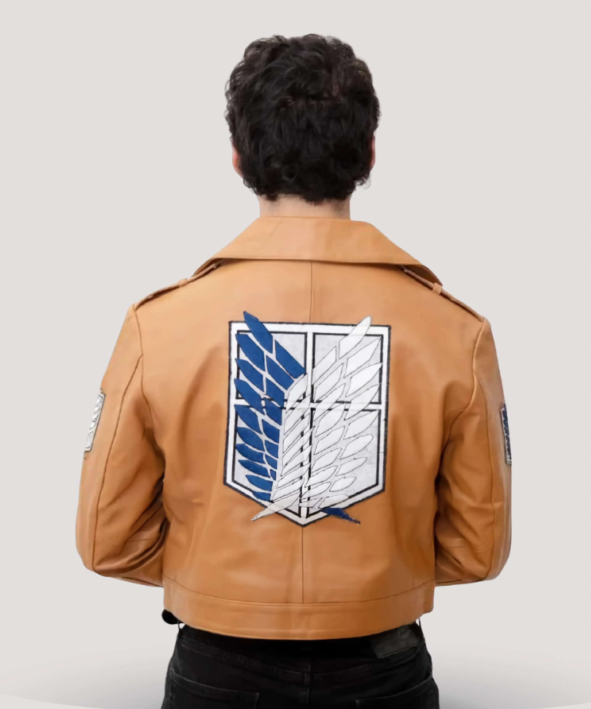 Attack-on-Titan-leather-jacket-hanging-on-a-rack-with-other-anime-outerwear-highlighting-brown-bomber-style-and-iconic-Survey-Corps-look
