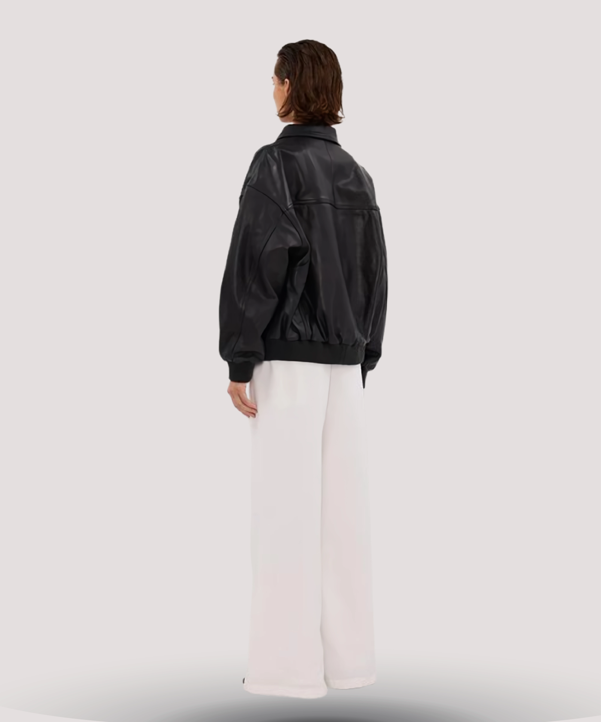 Back-view-of-oversized-black-leather-bomber-jacket-heavy-grade-leather-casual-street-style-look-available-to-buy-online