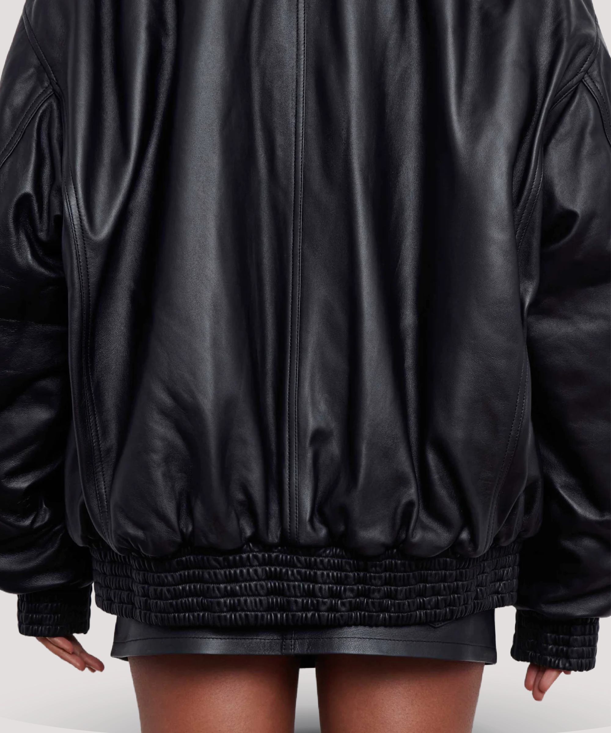 Candid-street-style-shot-of-woman-wearing-Selena-Gomez-black-leather-bomber-jacket-relaxed-fit-moves-naturally-with-every-step-great-for-daily-wear