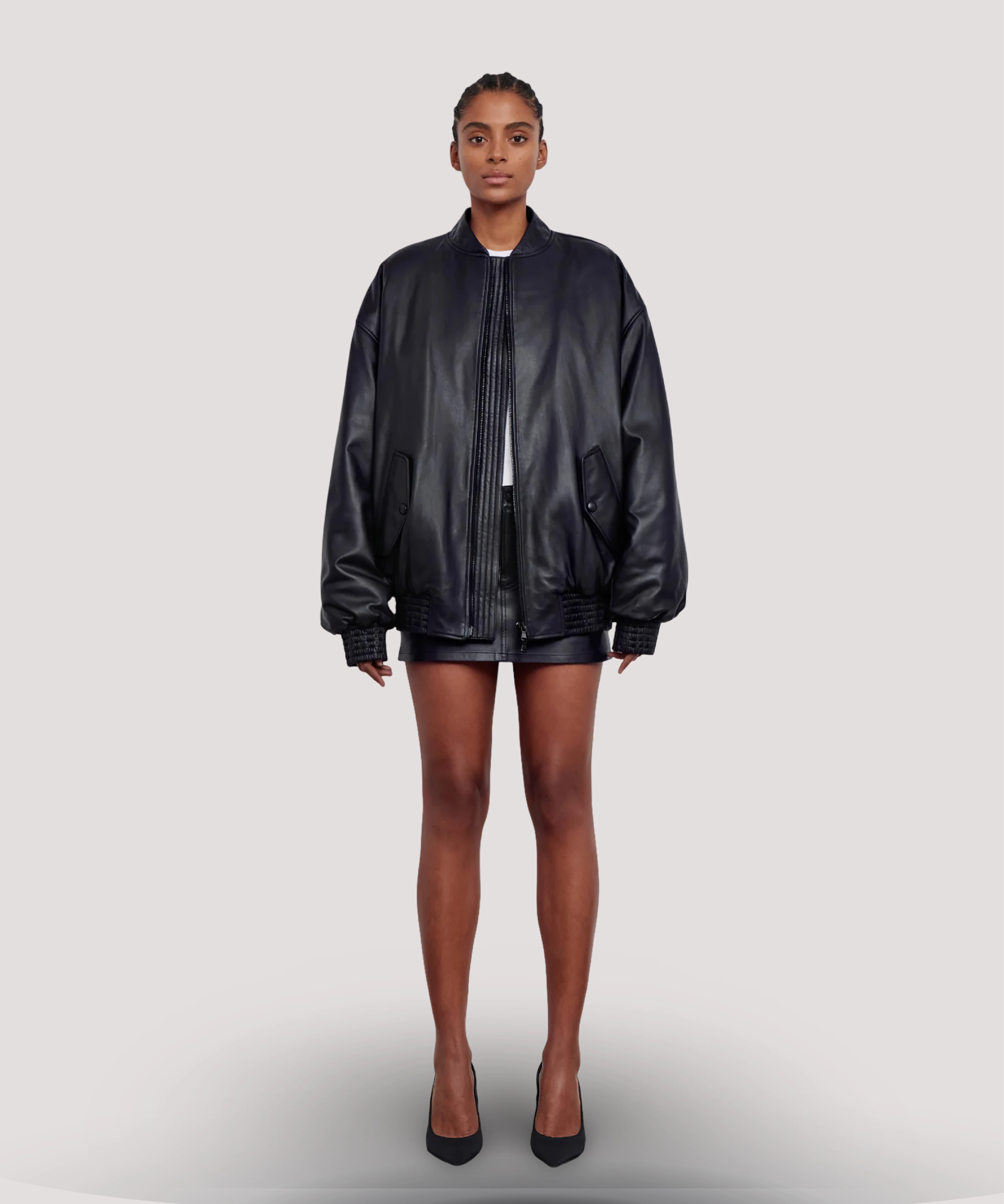 Model-wearing-Selena-Gomez-black-leather-bomber-jacket-for-women-with-front-zip-ribbed-cuffs-and-relaxed-fit-perfect-streetwear-and-casual-styling