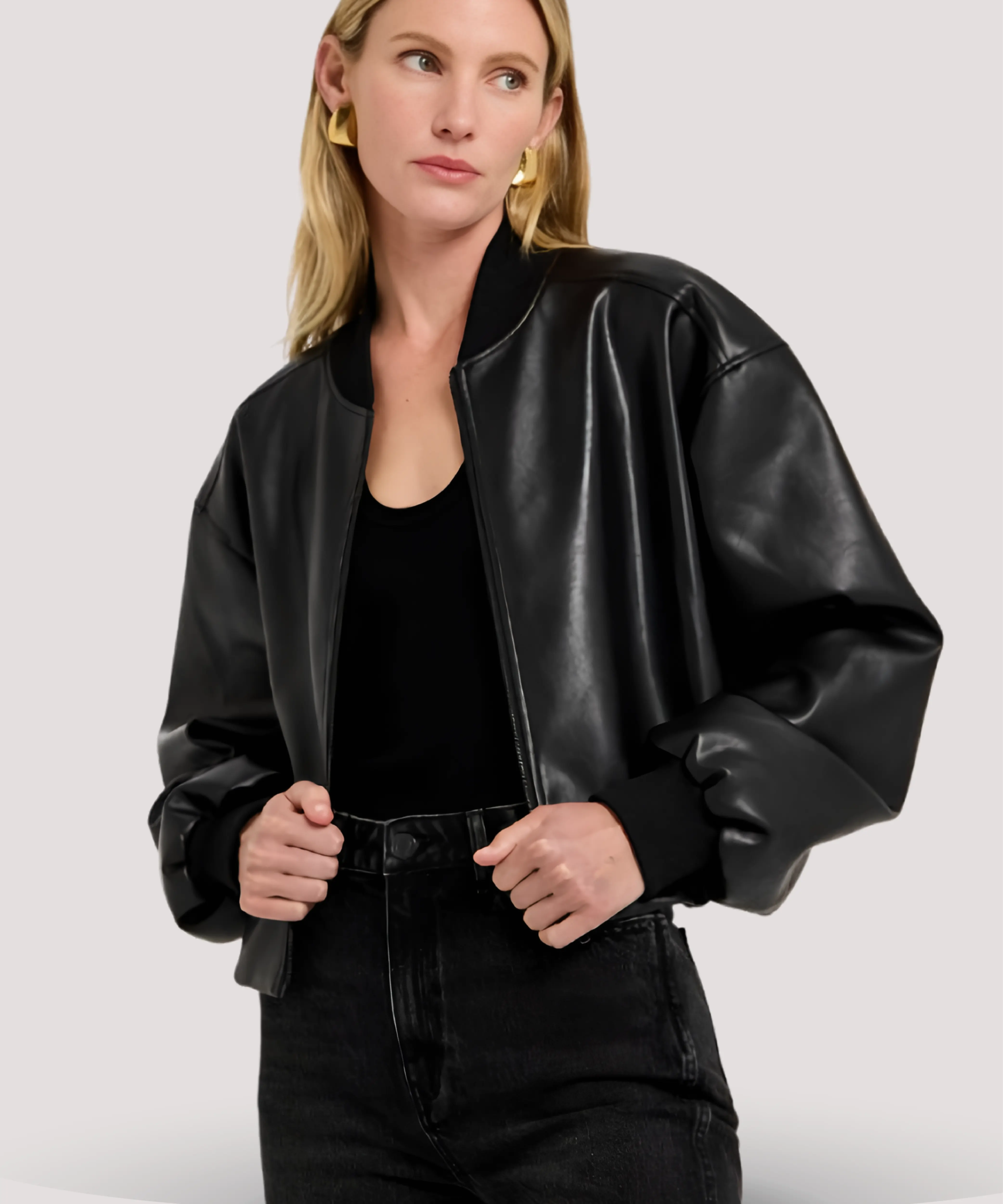 Sandra-Bullock-black-leather-bomber-jacket-with-front-zipper-and-ribbed-trim-ideal-for-women-seeking-classic-and-trendy-black-leather-outerwear-pieces
