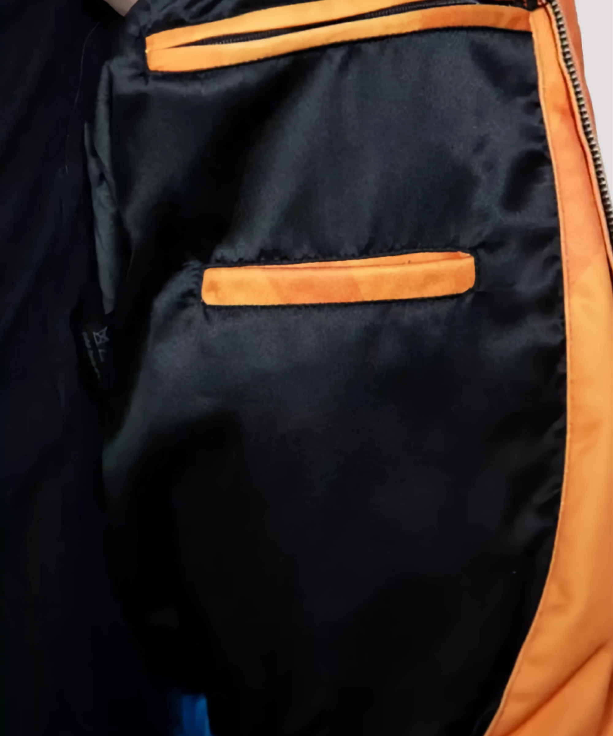 Side-profile-of-anime-inspired-Goku-orange-bomber-jacket-highlighting-durable-zipper-closure-comfortable-fit-and-vibrant-color-for-cosplay-or-everyday-wear