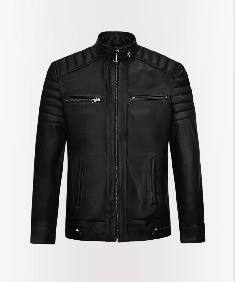 Andrew Tate wearing his signature black leather jacket facing forward