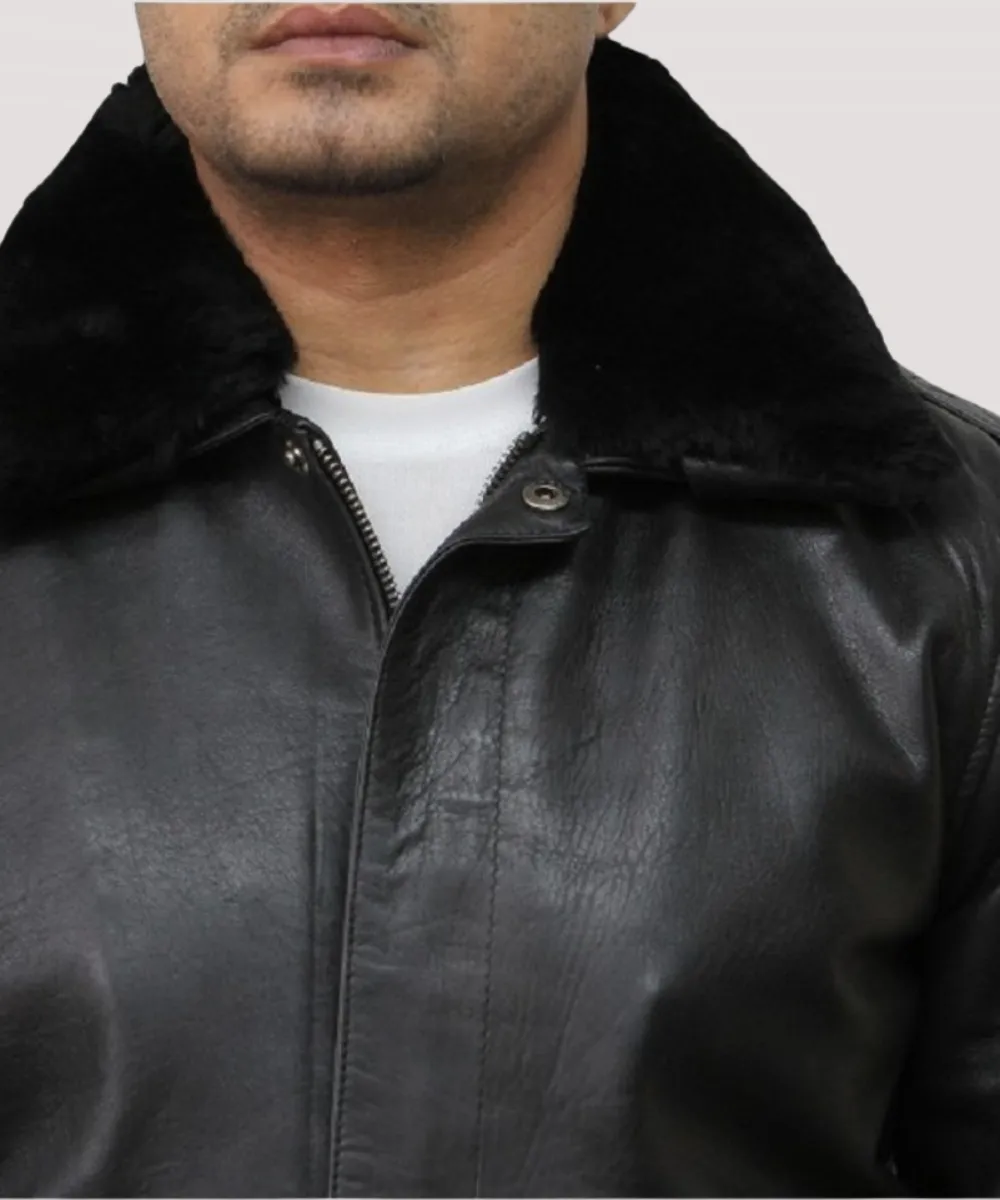 Black leather jacket with fur collar laid flat on white background showing zipper pockets and ribbed cuffs