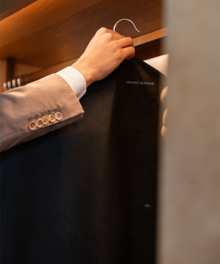 Hand holding a leather garment