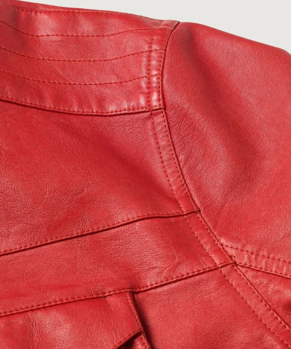 MatPat in a red leather jacket with casual styling, standing in front of bookshelf