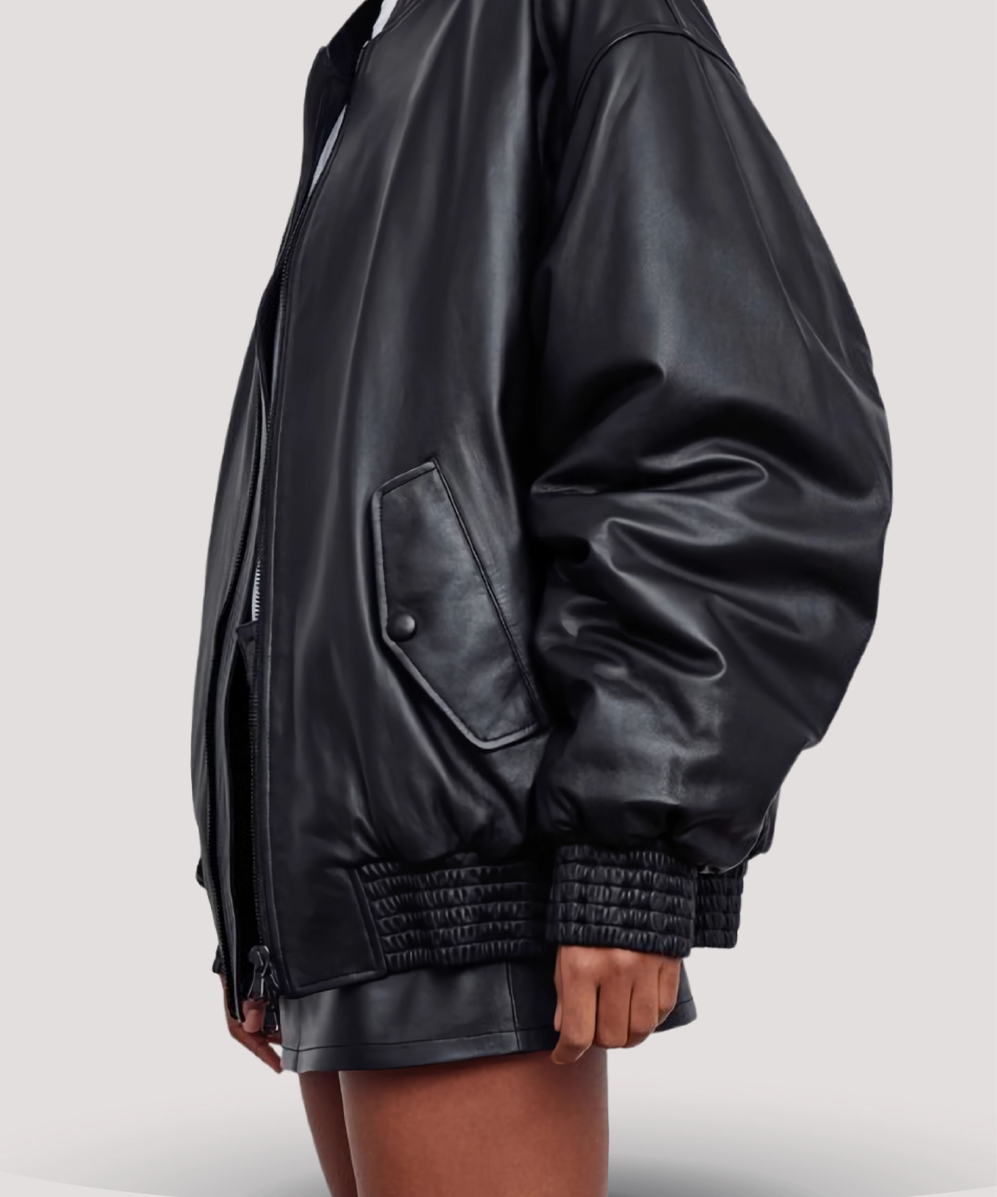 side-view-Selena-Gomez-style-womens-black-leather-bomber-jacket-styled-with-jeans-and-boots-effortless-outfit-idea-for-fall-and-transitional-weather