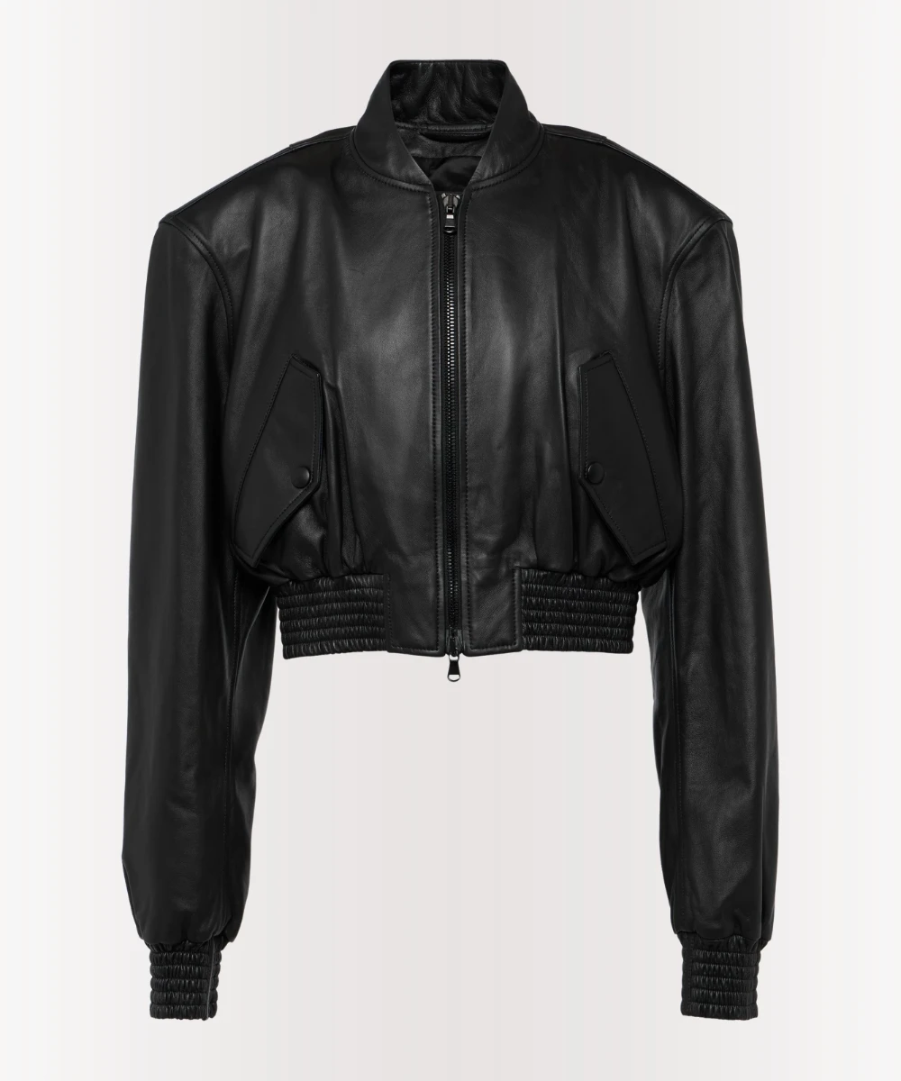 Woman wearing black cropped leather bomber jacket with ribbed cuffs and zipper front