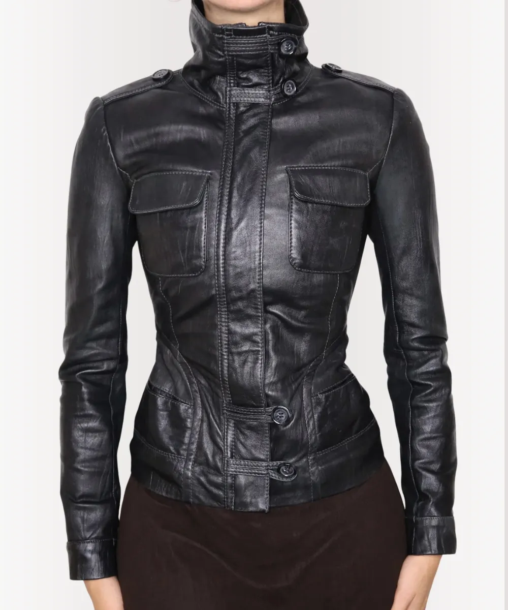 Woman wearing Y2K black leather moto jacket, front view with zipper details.