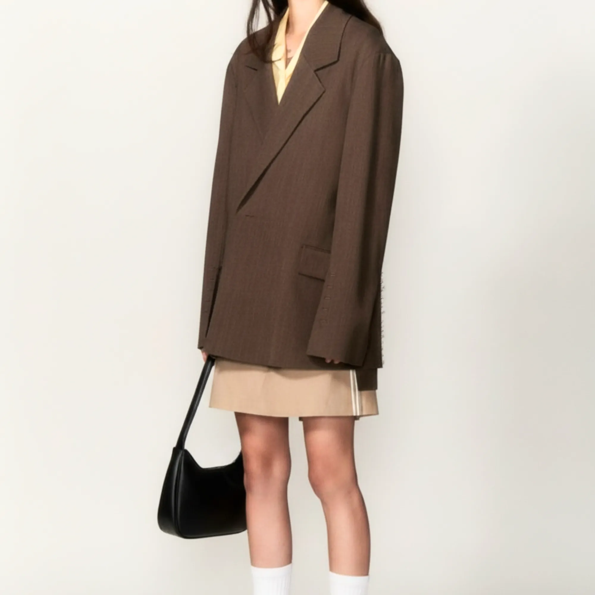 Close-up of Half Moon Shoulder Bag palladium hardware and smooth leather