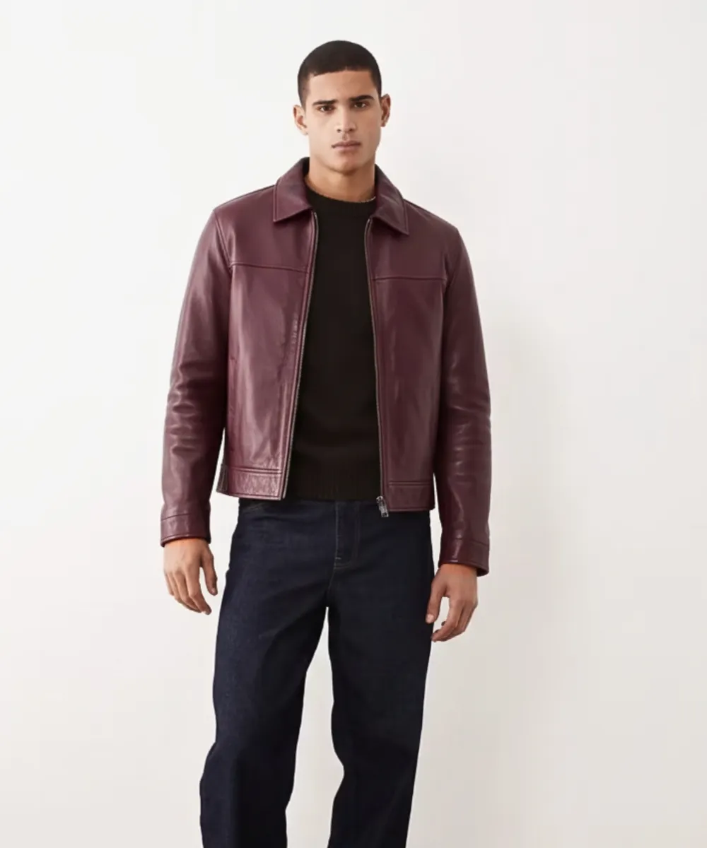 Men wearing burgundy leather jacket front view with zip closure and classic fit
