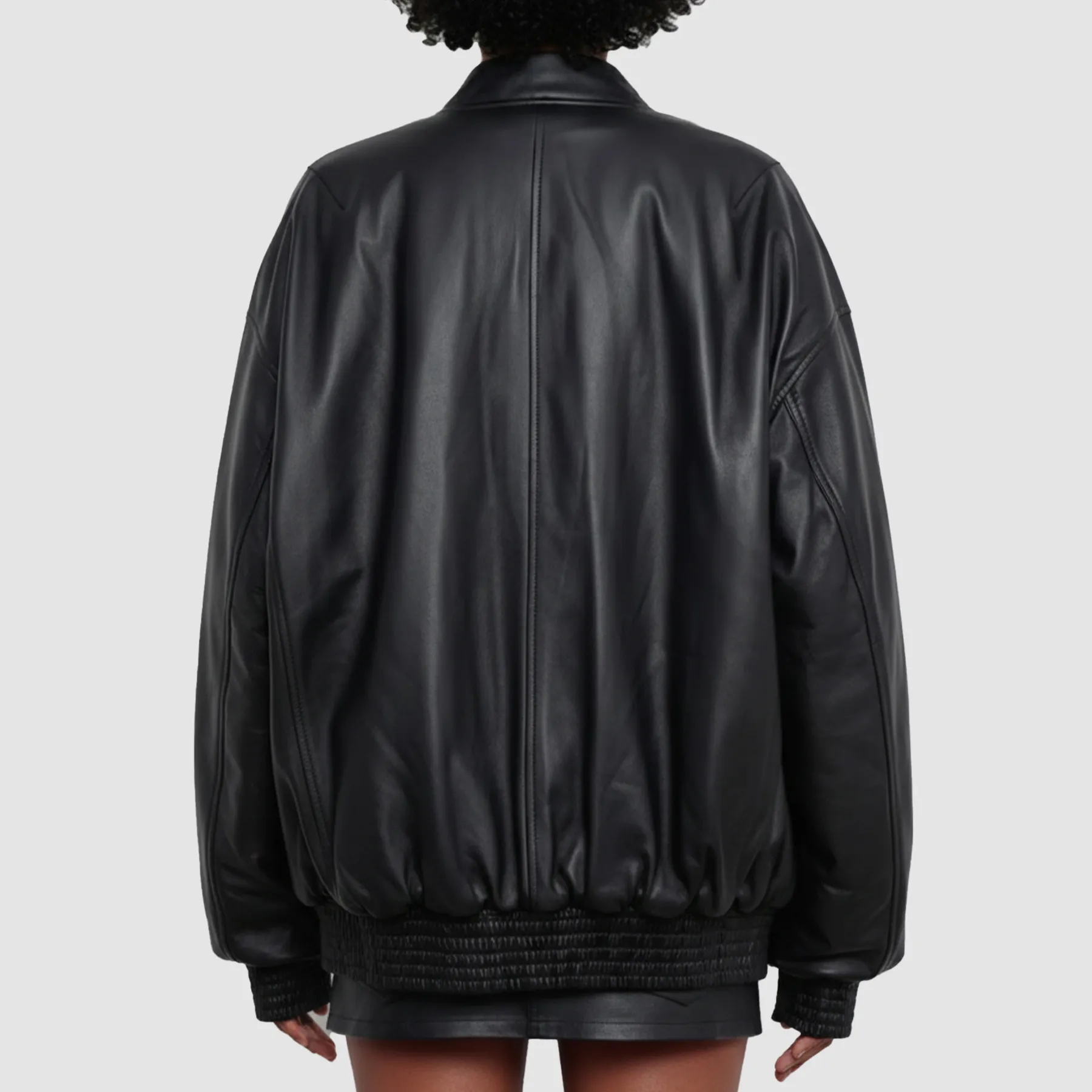 Candid-street-style-shot-of-woman-wearing-Selena-Gomez-black-leather-bomber-jacket-relaxed-fit-moves-naturally-with-every-step-great-for-daily-wear.