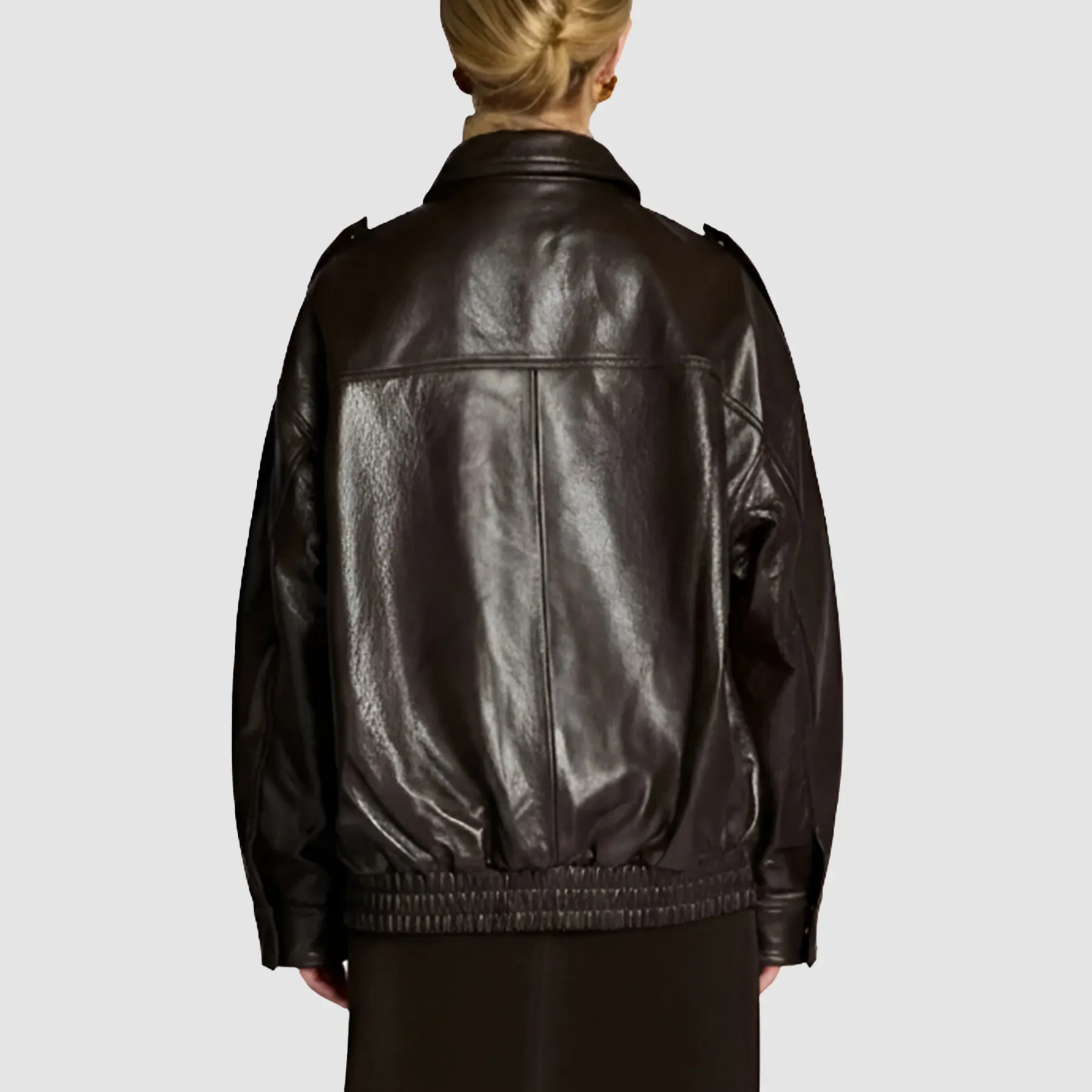 Close-up of brown vintage leather bomber jacket texture detail