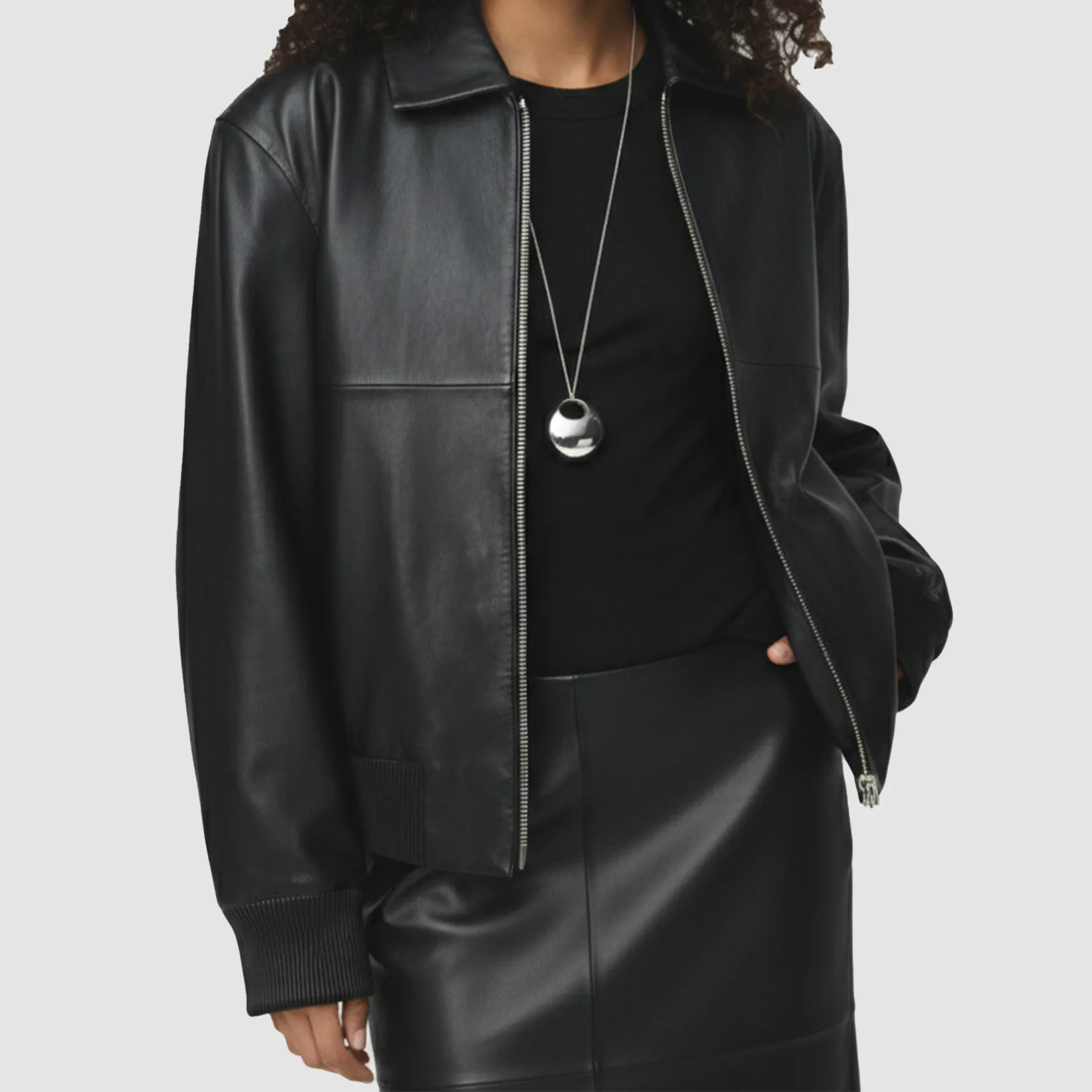 Model-wearing-oversized-leather-bomber-jacket-with-dropped-shoulders-and-breathable-viscose-lining-ideal-for-year-round-comfort-and-edgy-style.