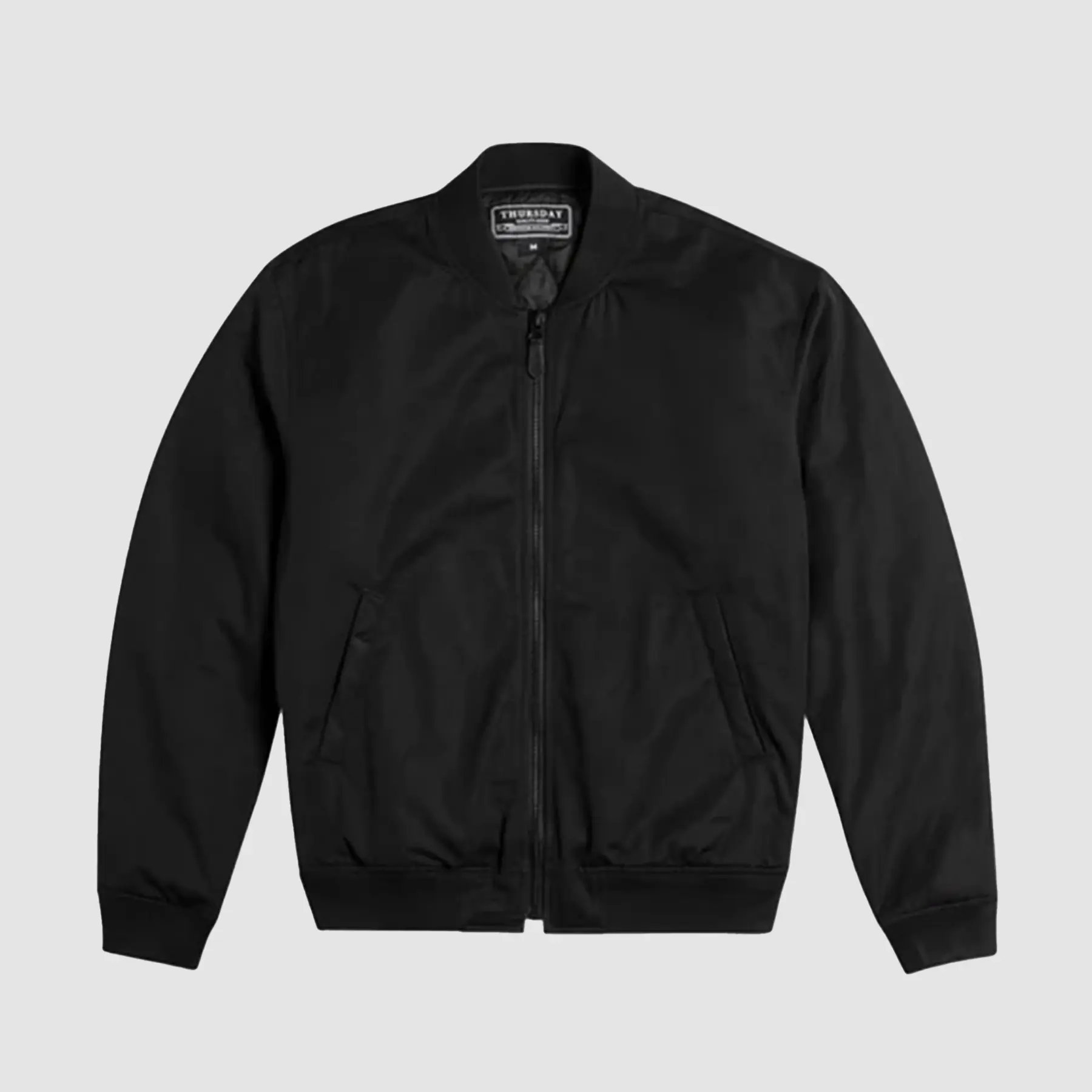 Men’s black bomber jacket front view with ribbed collar, zip closure, and modern fit inspired by the MA-1 flight jacket.