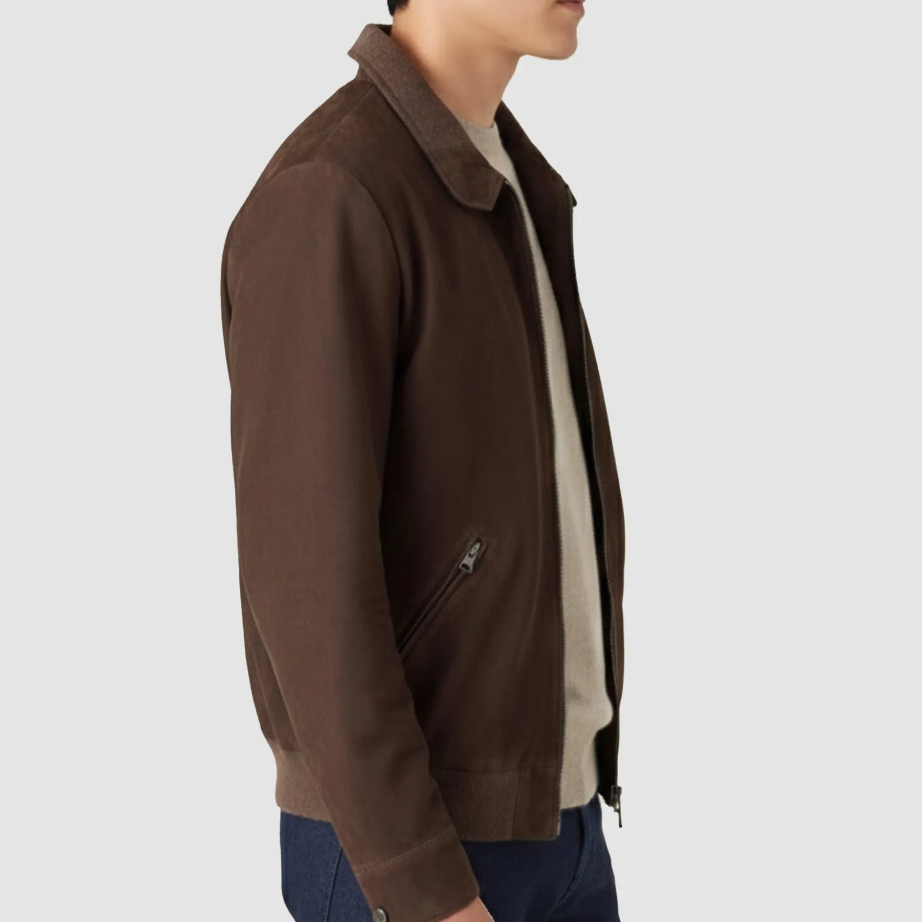 Side angle of goatskin leather jacket highlighting the tailored bomber fit and waistline shape.