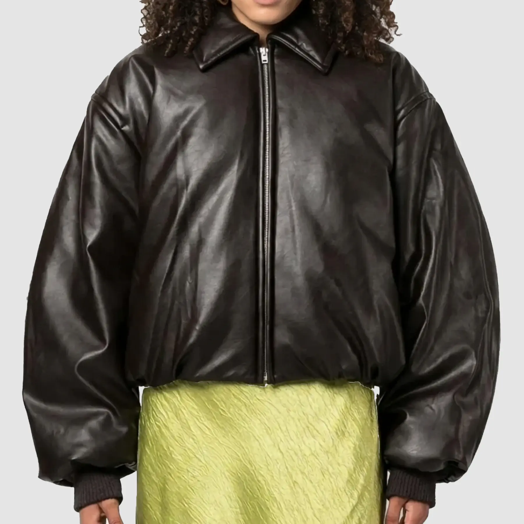 Close-up of zipper closure and rib-knit cuffs on Molly Mae brown leather bomber jacket