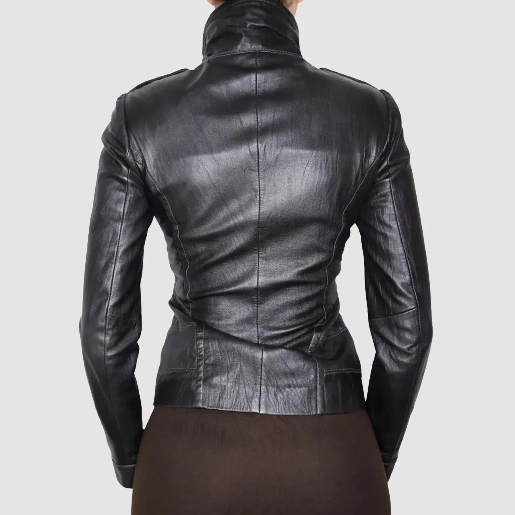Back view of Y2K black leather moto jacket showing clean panel design and fitted biker silhouette.