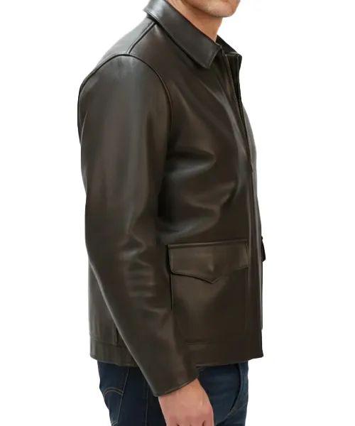 Close-up-of-Indiana-Jones-jacket-brass-D-rings-and-adjustable-leather-side-straps-on-brown-leather