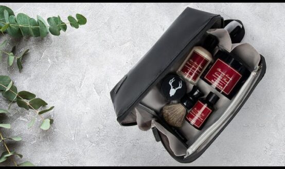 Leather Dopp kit with toiletries for travel, showing organization compartments